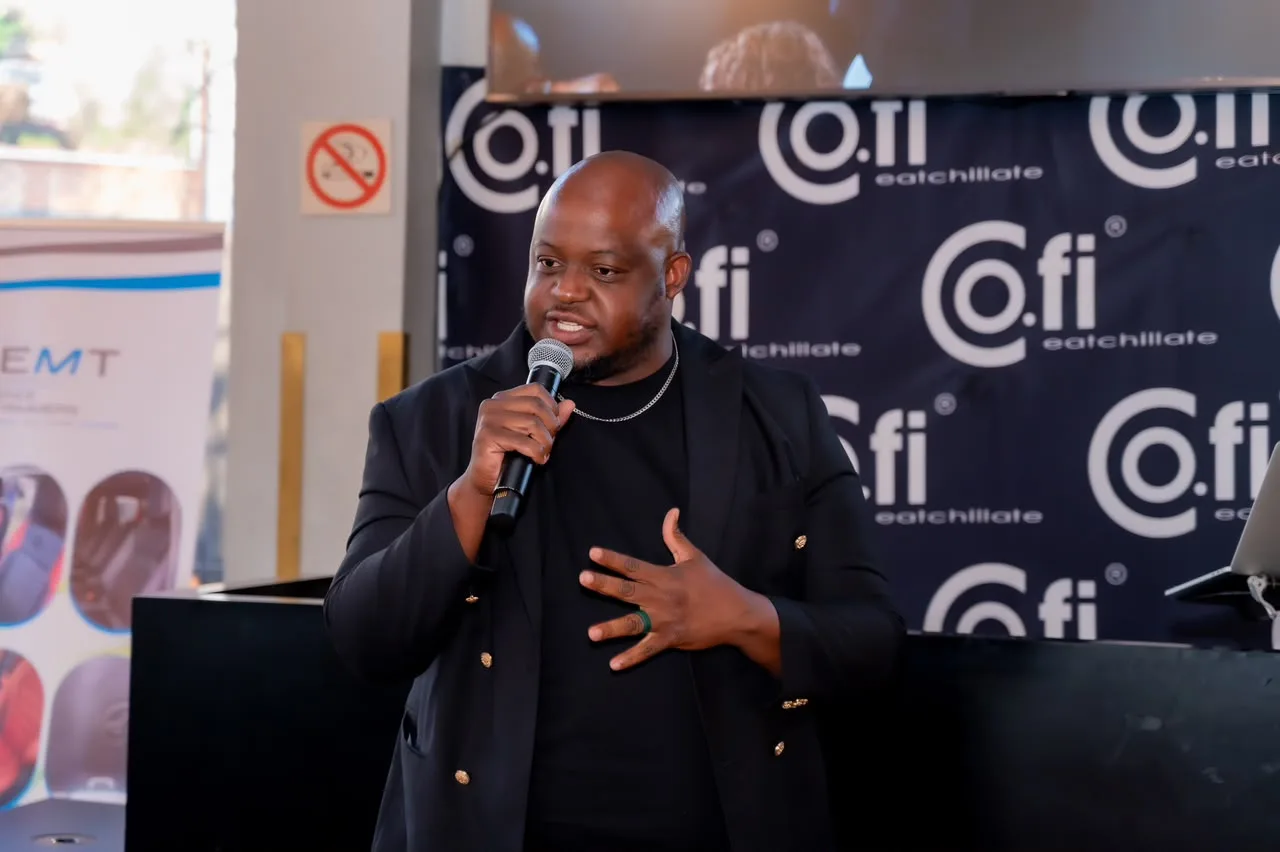 Oscar hosting a corporate event, microphone in hand