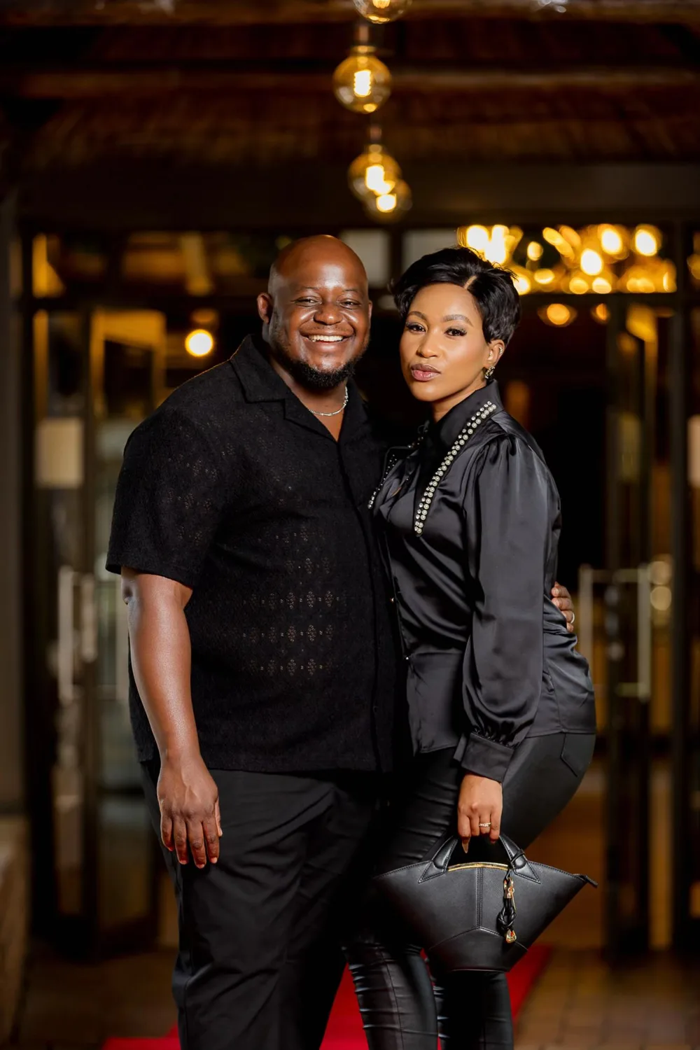 Oscar and Thandeka smiling, arm in arm